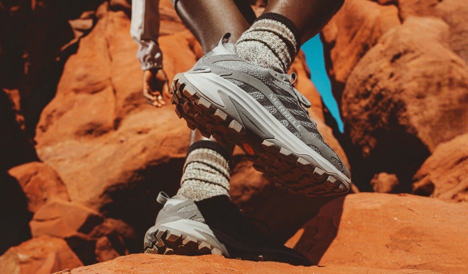 Close-up of Merrell Moab Speed 2 hiking shoes on red rock